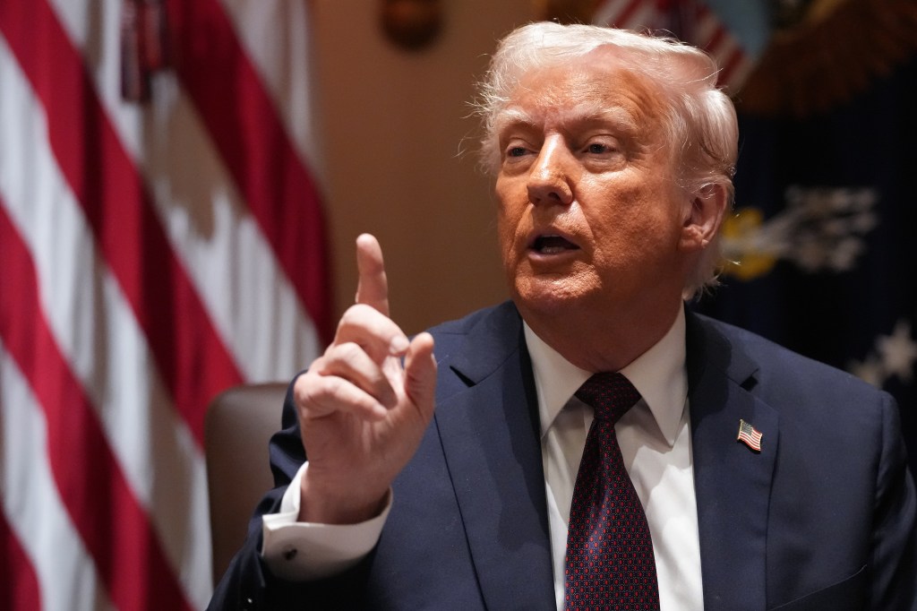 President Donald Trump speaks to reporters during a cabinet meeting at the White House on March 24, 2025.