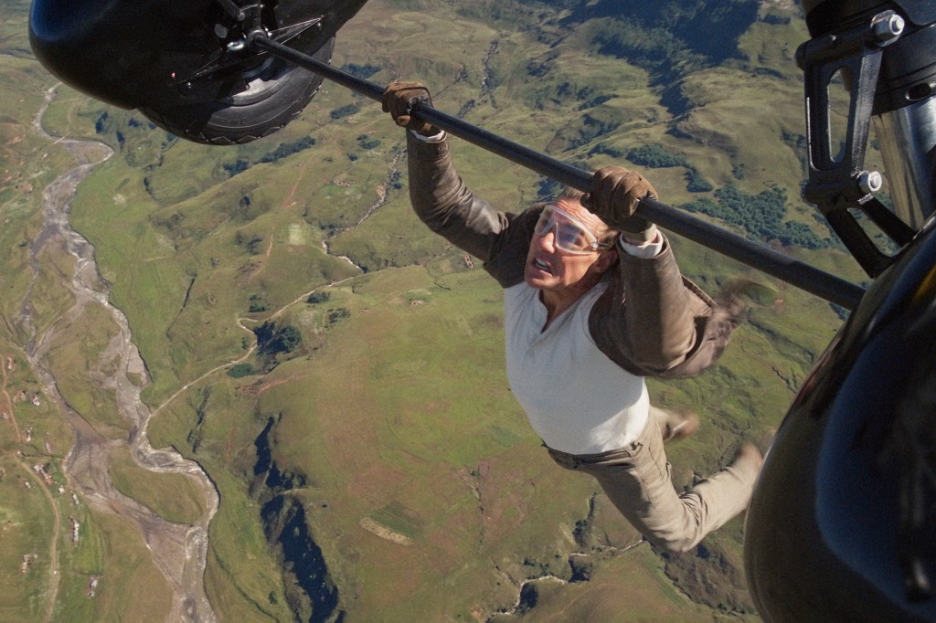 Tom Cruise hanging from a helicopter. 