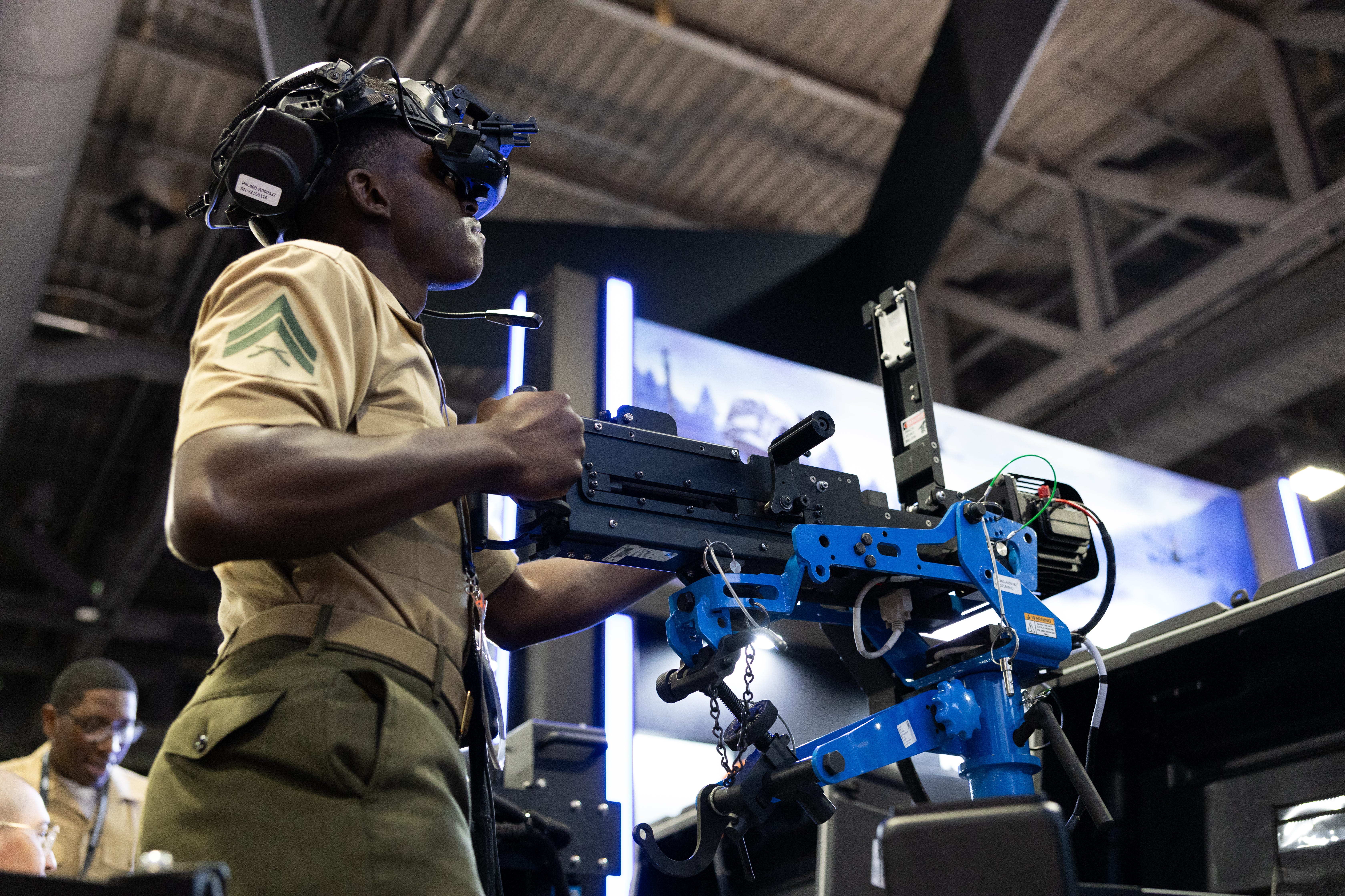 A Marine shoots a simulated M2 machine gun via virtual reality during the Modern Day Marine expo in Washington, D.C., May 1, 2025.