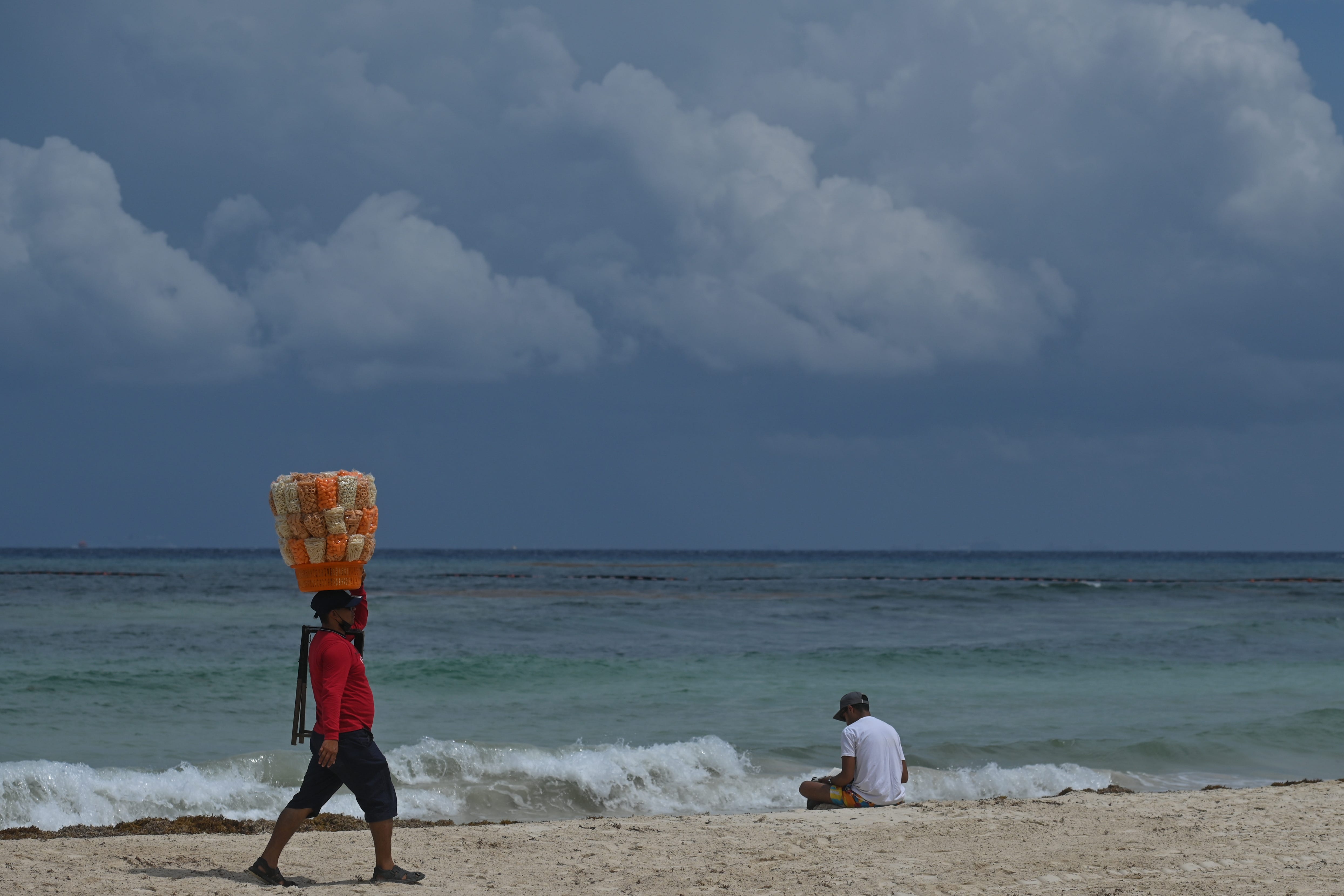 playa del carmen with two people on the beach