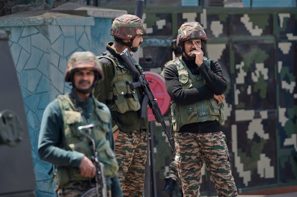 Indian army soldiers stand guard after loud explosions were heard in Srinagar, Indian controlled Kashmir, Saturday, May 10, 2025.
