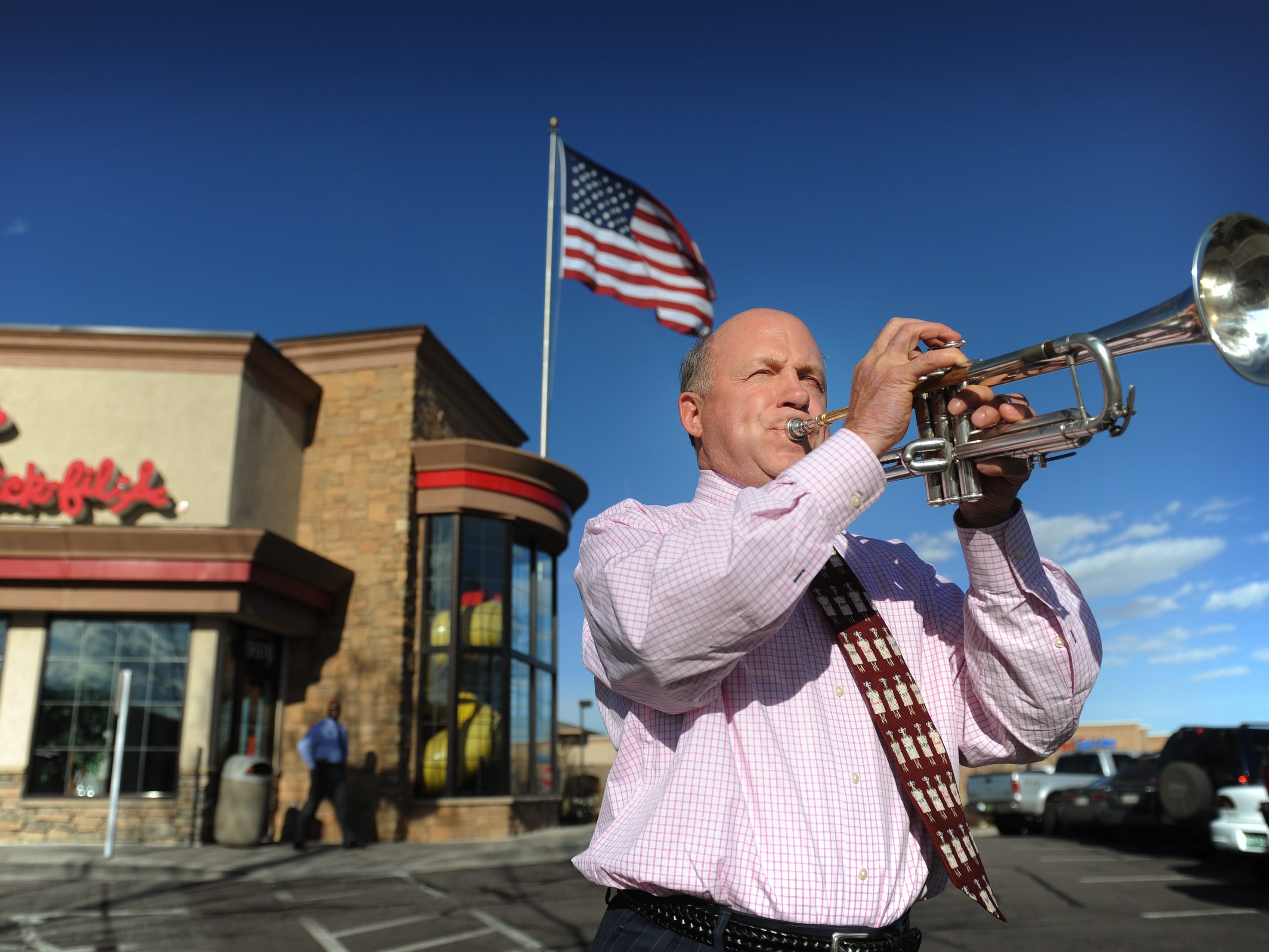 Chick-fil-A Inc. president and COO Dan Cathy, son of the chain's founder Truett Cathy, sounds the trumpet while visiting one of his franchises.
