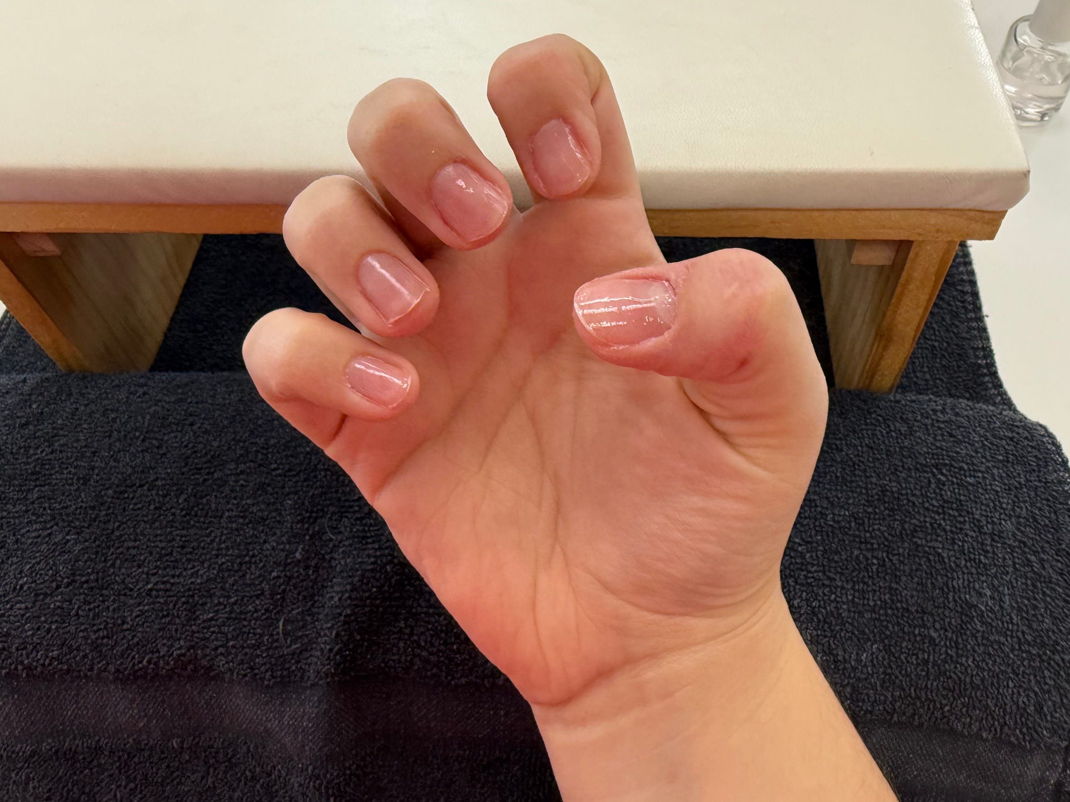 Gia's nails with a coat of clear polish.