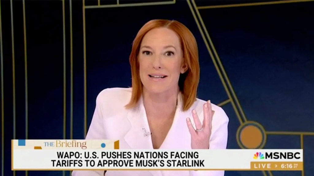 Jen Psaki hosts her new show in a white blazer.