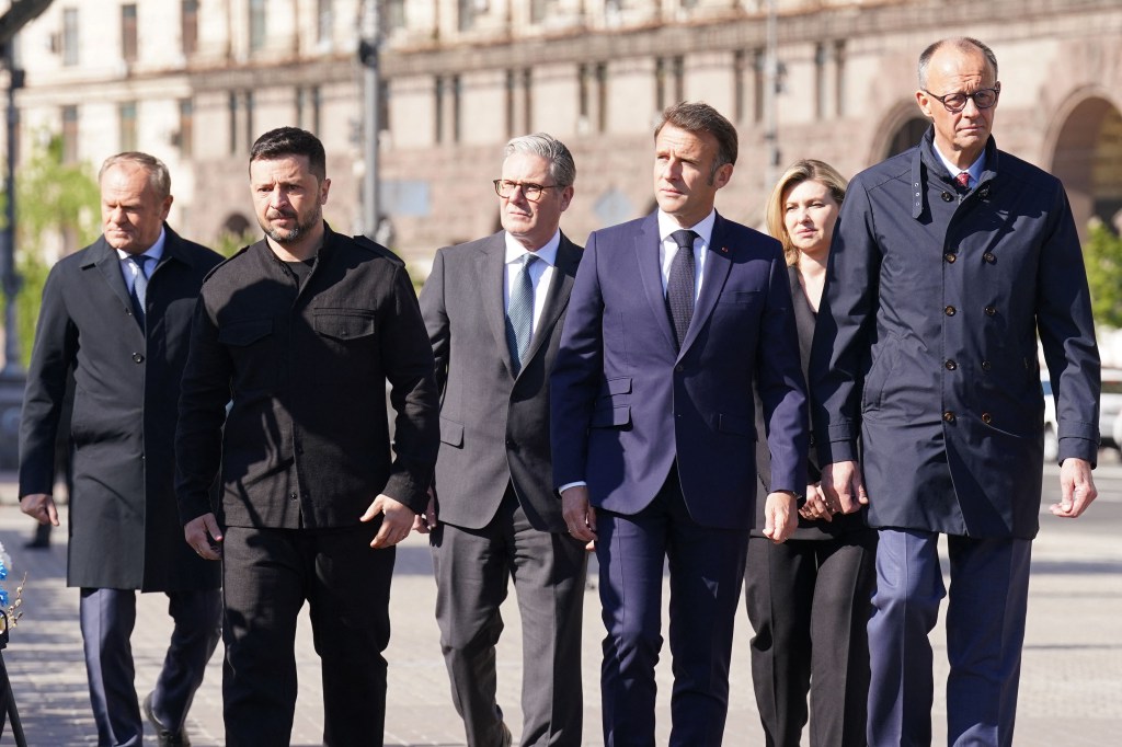 Poland's Prime Minister Donald Tusk, Ukraine's President Volodymyr Zelensky, Britain's Prime Minister Keir Starmer, France's President Emmanuel Macron, Olena Zelenska and Germany's Chancellor Friedrich Merz pay their respects to the victims of war at the Memorial for the Fallen at the Independence Square (Maidan) in Kyiv on May 10, 2025.