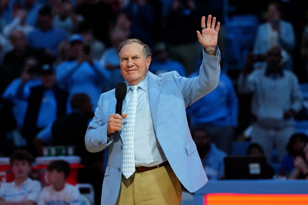 Head coach Bill Belichick of the North Carolina Tar Heels addresses the crowd during halftime in the game against the La Salle Explorers at the Dean E. Smith Center on December 14, 2024 in Greensboro, North Carolina