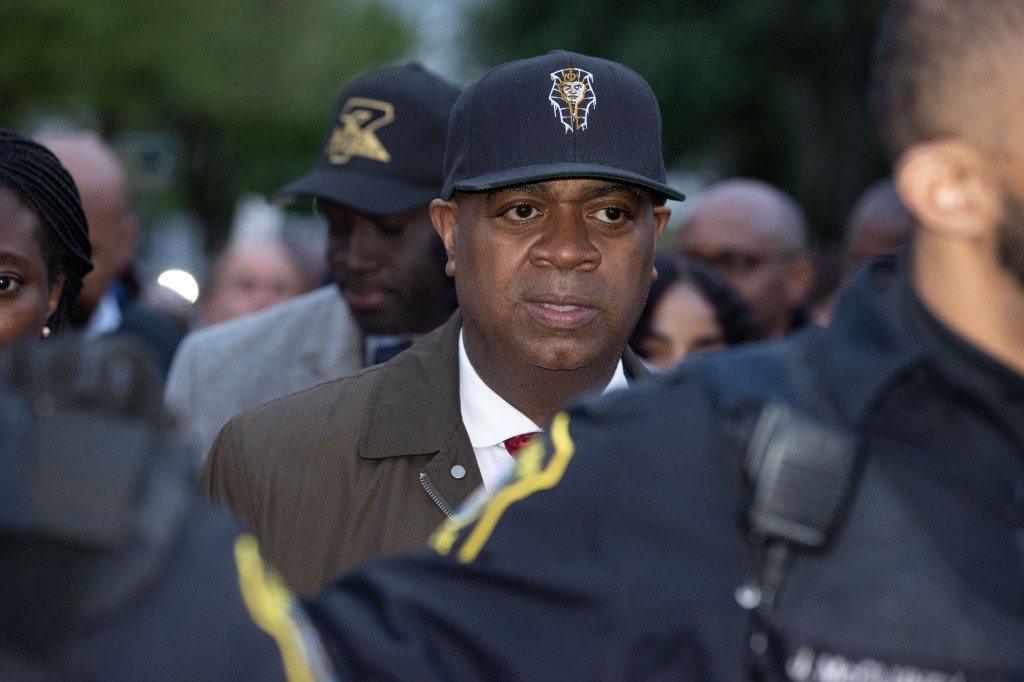 Newark Mayor Ras Baraka walks surruounded by Newark police officers outside a detention center in Newark, Friday, May 9, 2025 after his release