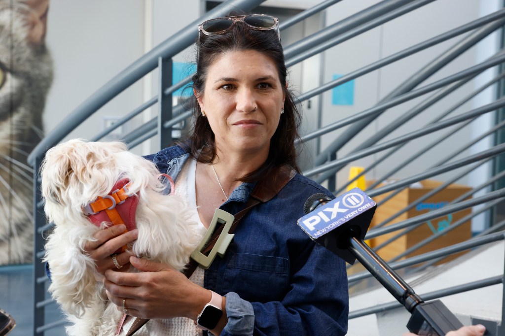 A photo shows Nicole DeSalvo holding Hudson.