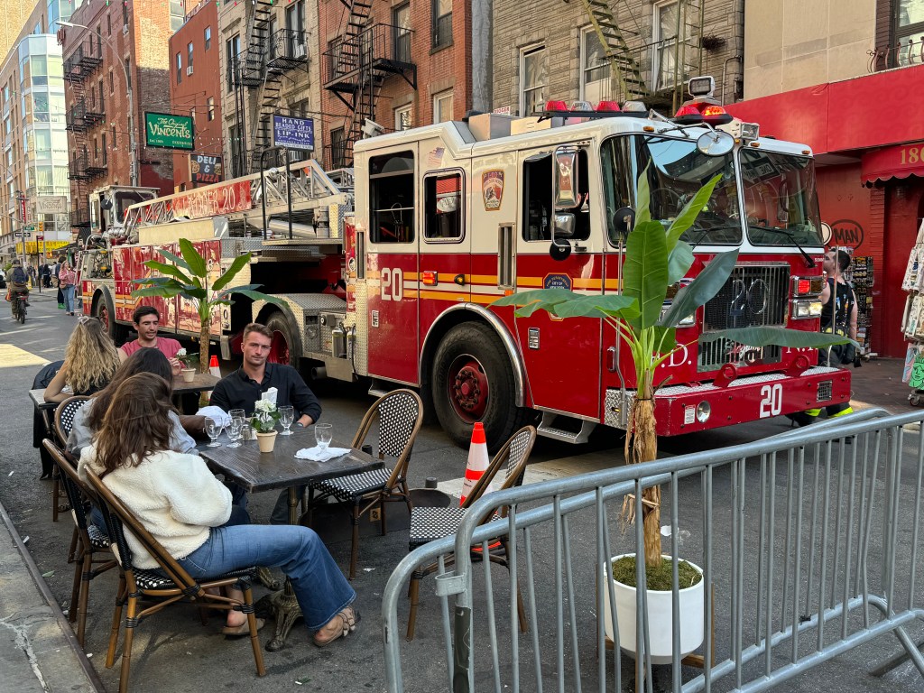 The older victim received CPR as paramedics carried him out on a stretcher -- in front of nearby eateries, like Casa Bella and Manero's Pizza, where outdoor diners and passersby appeared to barely take notice.