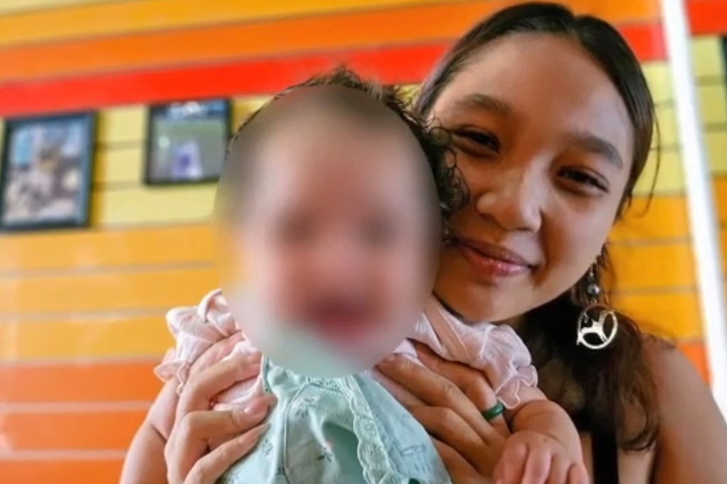 An infant was inside the car but was not harmed in the alleged assault.