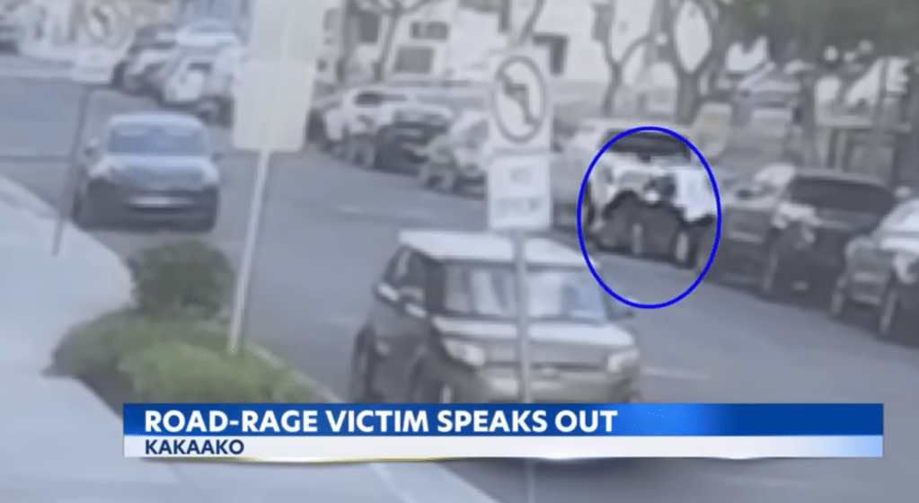 Security cameras captured the moment Radimak allegedly punched the teen driver through the open driver's window on May 7, 2025.