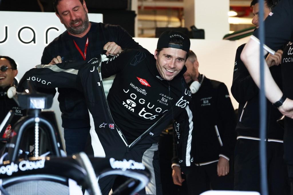 Brooklyn Beckham prepares to drive in the garage during the second day of the Formula E Evo Sessions at Miami International Autodrome on March 06, 2025 in Miami, Florida. 