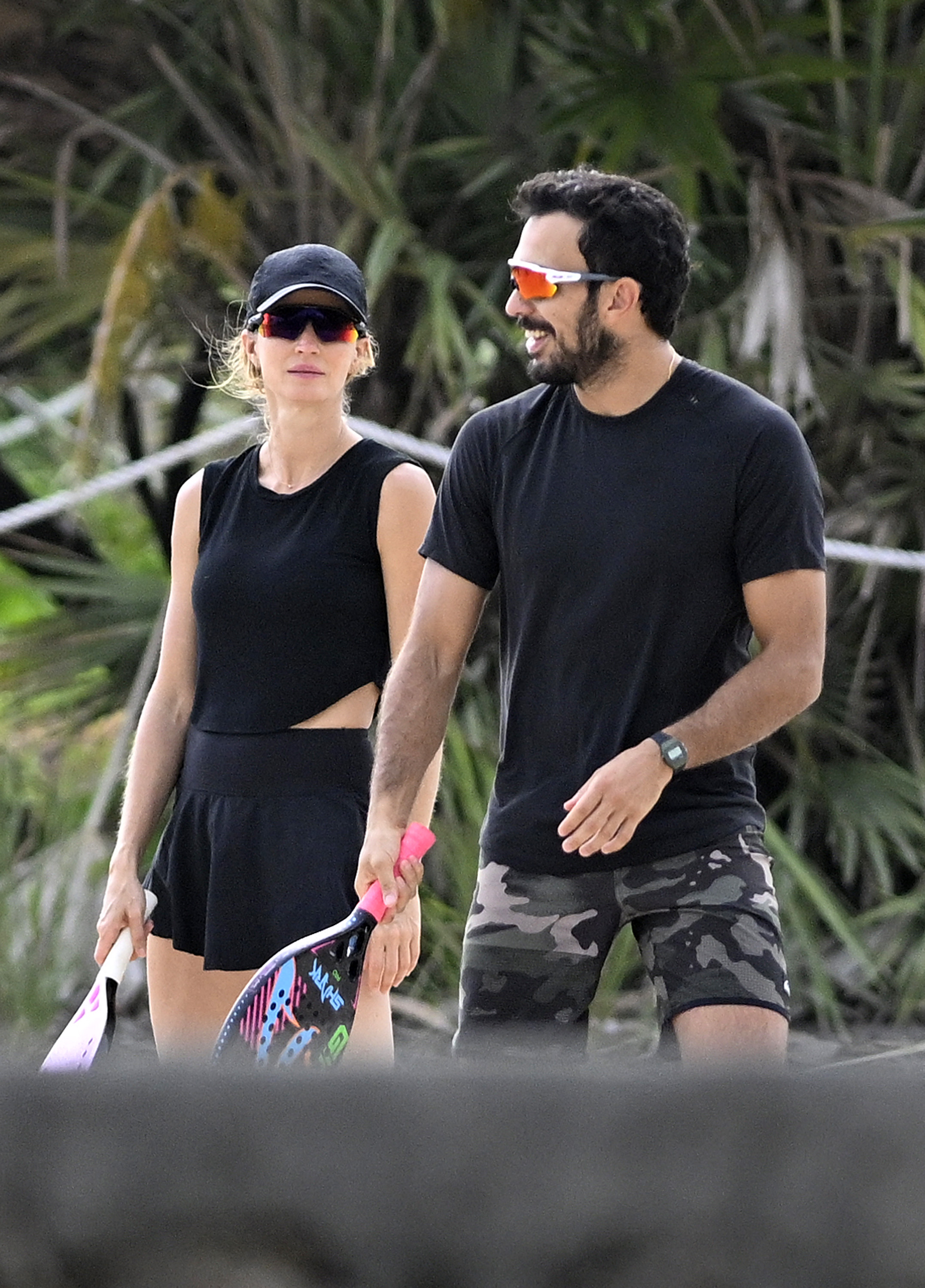 Gisele Bündchen and Joaquim Valente playing tennis