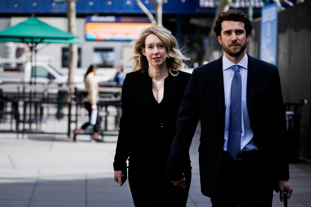 Former Theranos CEO Elizabeth Holmes and her partner Billy Evans exiting the Robert E. Peckham U.S. Courthouse in San Jose, California.