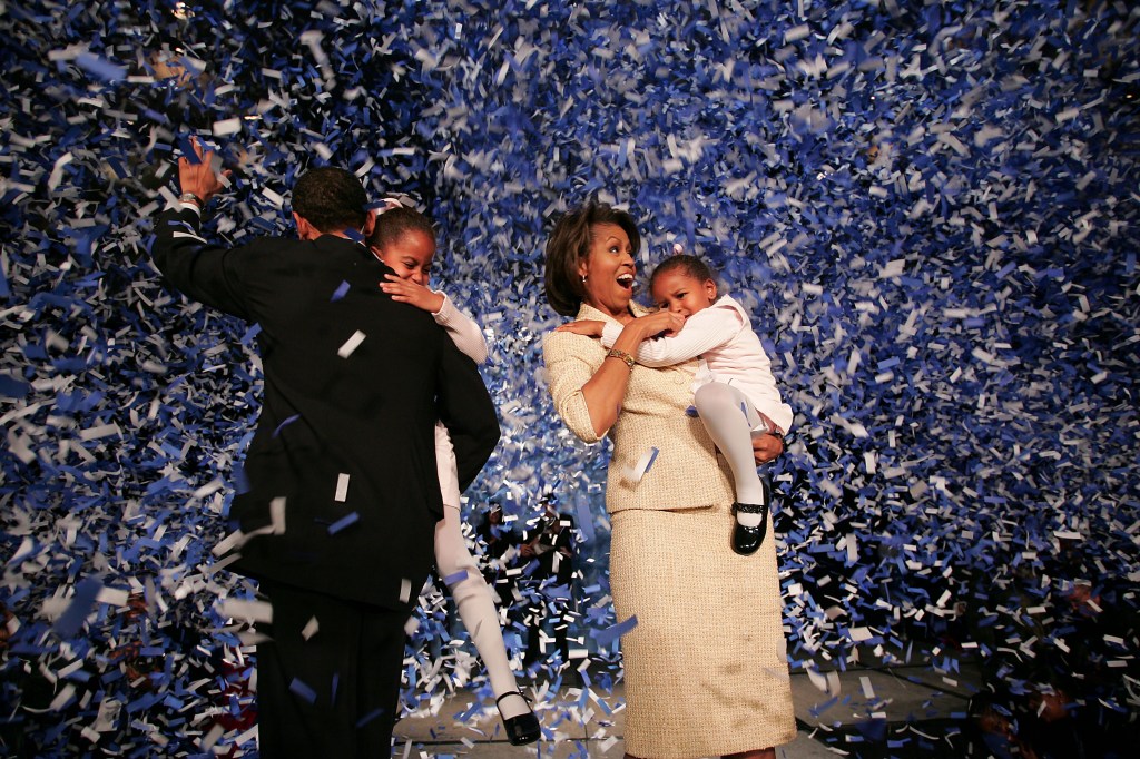  Senate Barack Obama (D-IL) (L) holding his daughter Malia with wife Michelle and youngest daughter Sasha (R) celebrate his victory with supporters over Repulican rival Alan Keyes November 2, 2004 in Chicago, Illinois. 