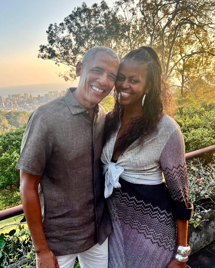 Barack and Michelle Obama pose for a photo.