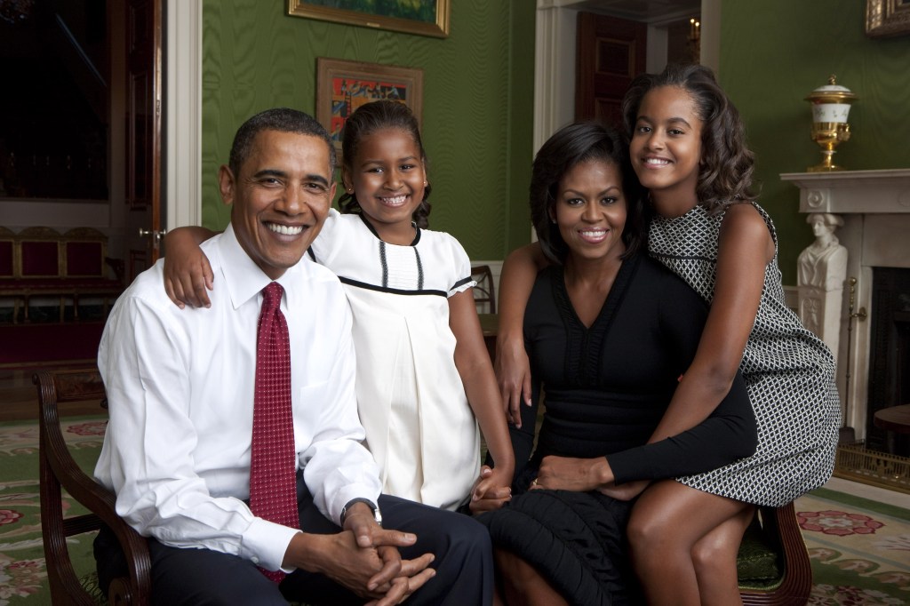 Barack Obama, daughter Malia Obama, first lady Michelle Obama and daughter Sasha Obama sit for portrait in the Green Room of the White House September 1, 2009 in Washington, DC.