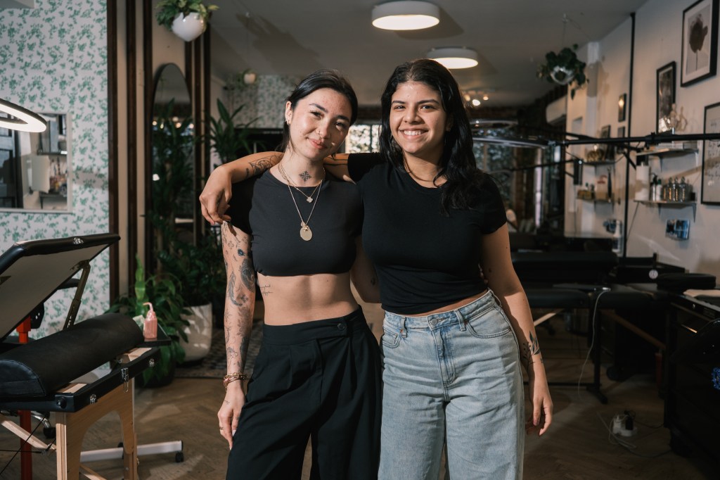 Tattoo artists Isabella Dizon (left) and Carolina Mogollon at Nice Tattoo Parlor in Williamsburg, Brooklyn.