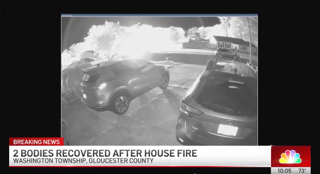 Cameras from across the street show the bright burst of flames from inside the home at around 2 a.m.