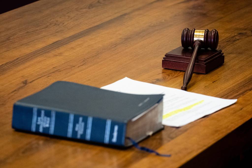 Courtroom gavel and law book. 