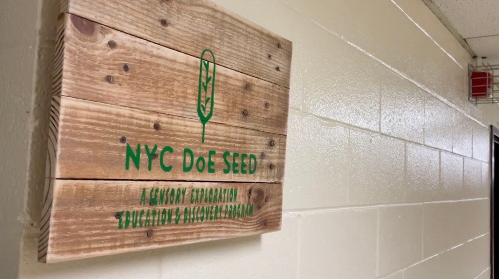 A sign depicting the NYC DOE SEED program