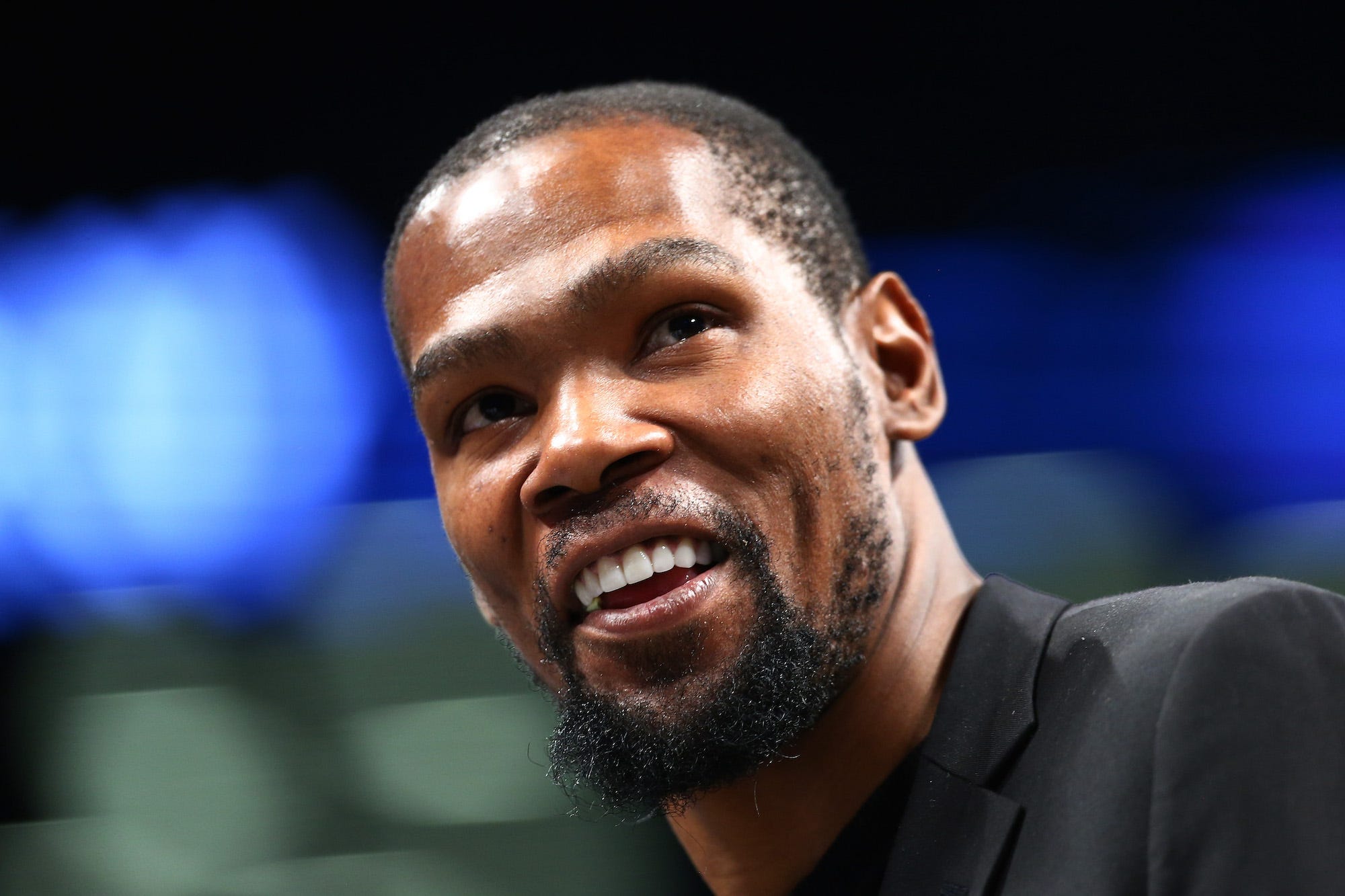 Kevin Durant looks up and smiles.