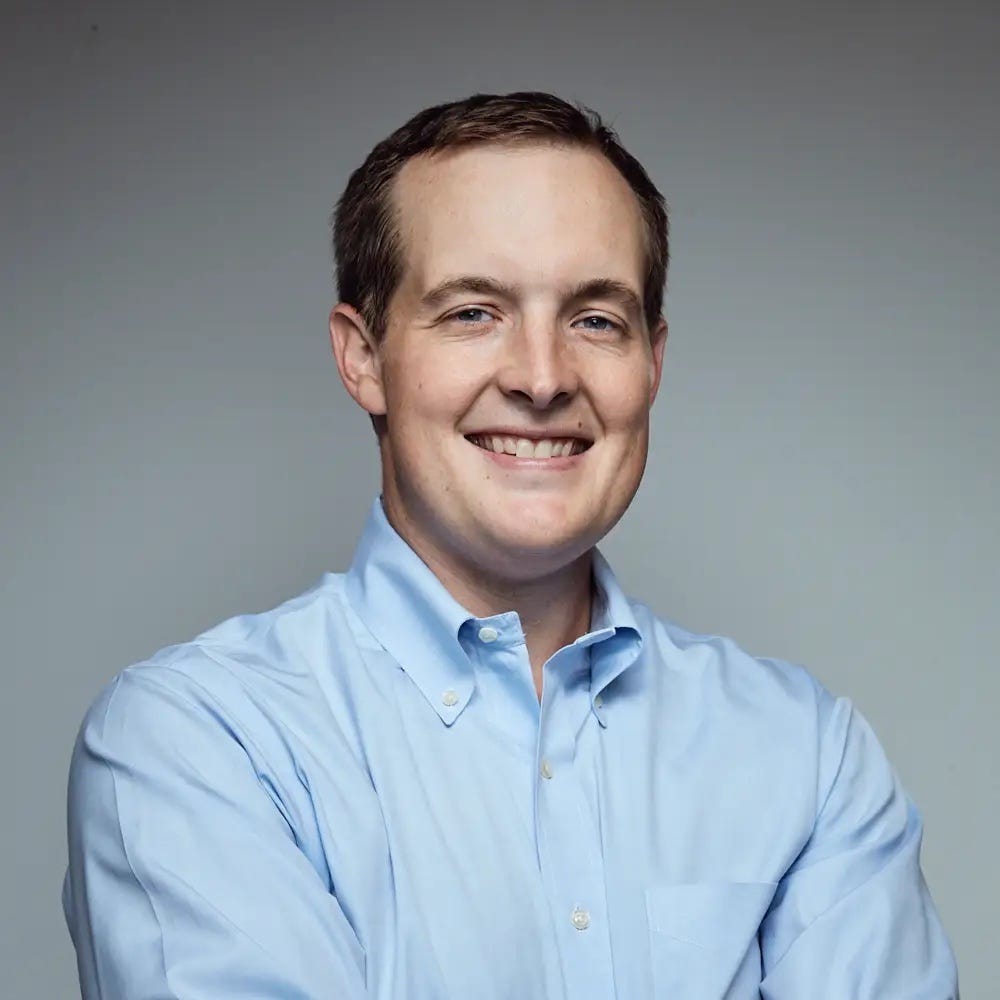Nat Turner, a general partner at Operator Partners, poses for a photo against a grey background.