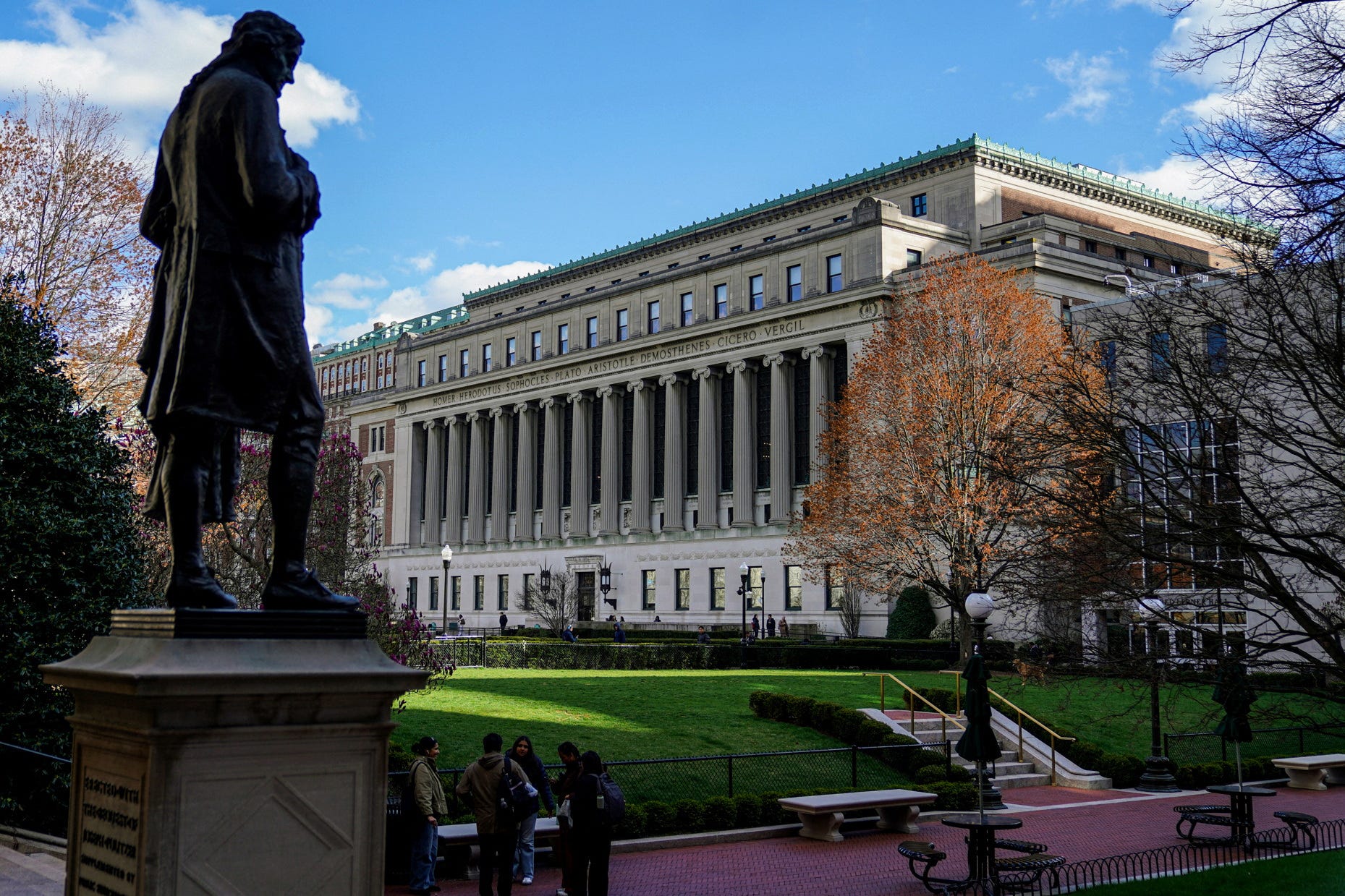 People stand on campus at Columbia University in New York City, April 8, 2025.