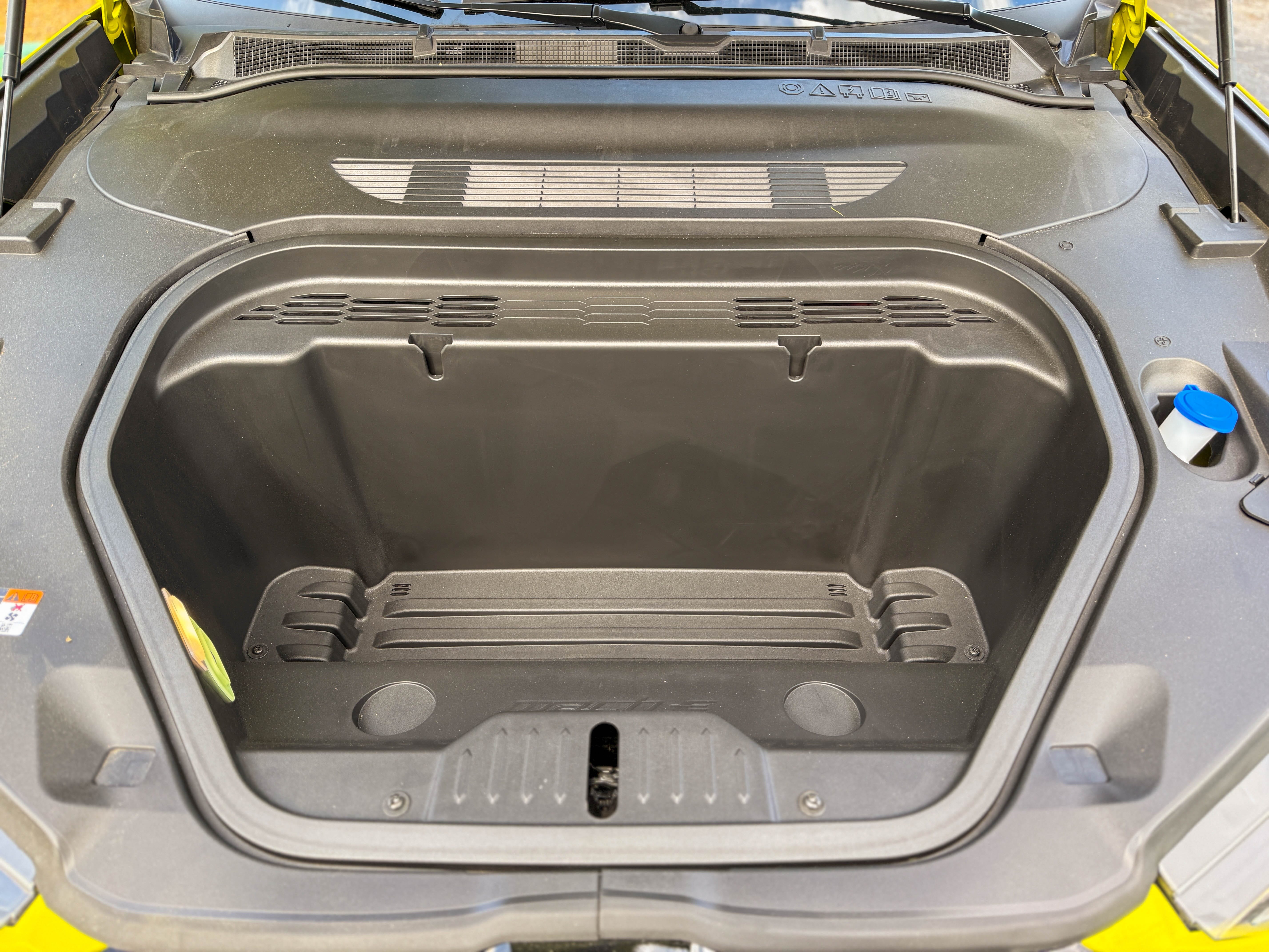 The 4.8 cubic foot front trunk in a yellow 2025 Ford Mustang Mach-E Rally EV SUV.