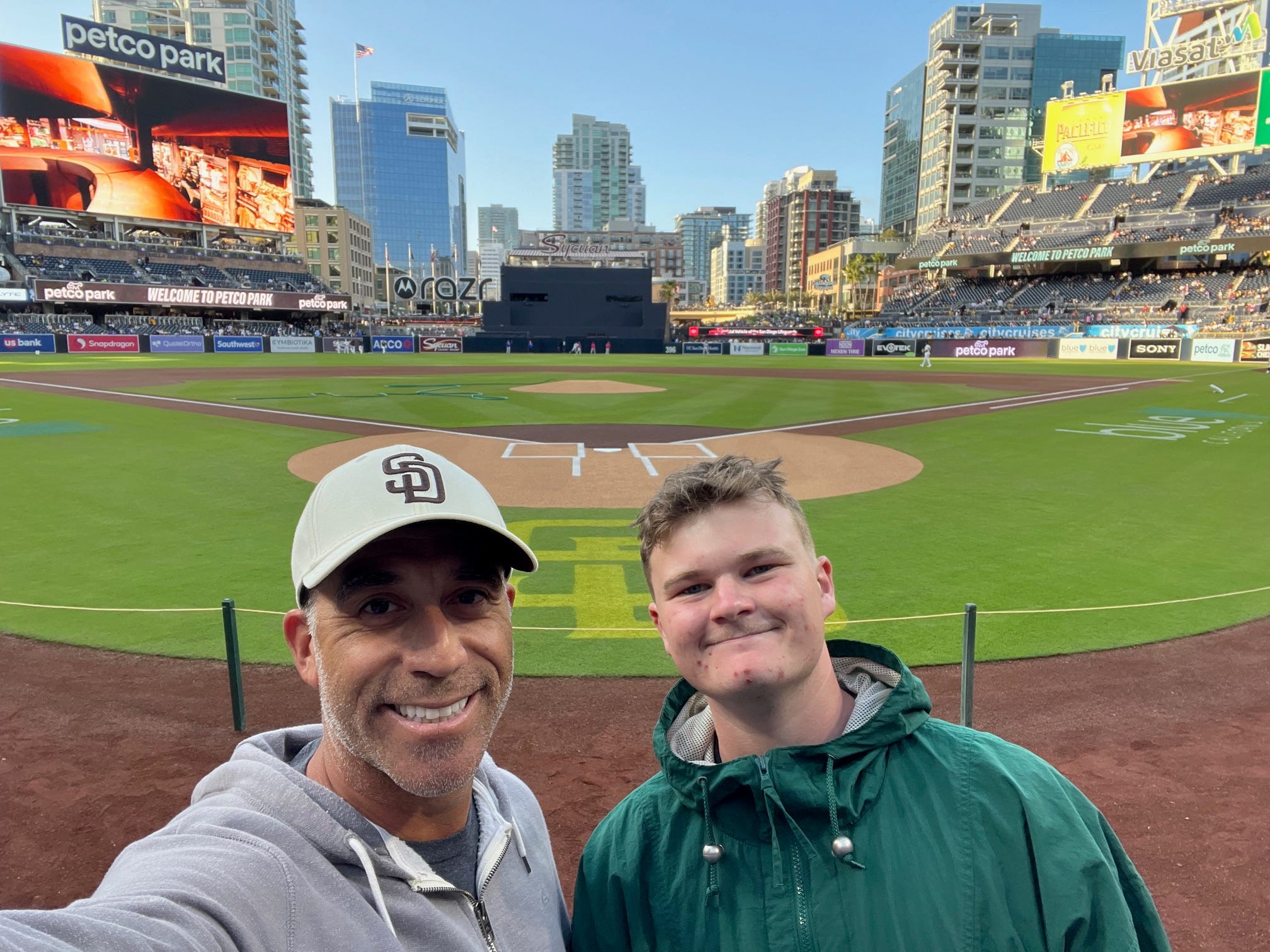 Kristina Varsho's son (right) with his Big (left) at a baseball stadium