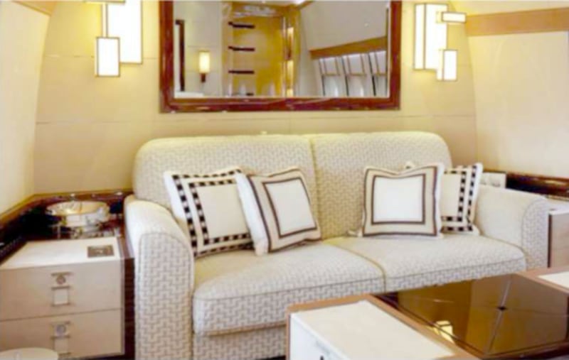 A couch in the master bedroom.