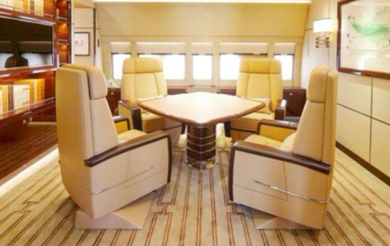 A table and four chairs in the private office, which also has built-in bookshelves, a monitor and a private bathroom.