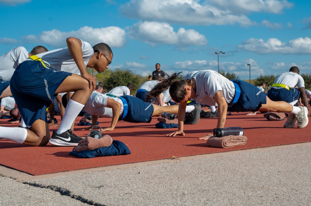 Olympic athlete Anita Alvarez performing push ups during her physical fitness test at Basic Military Training in Joint Base San Antonio-Lackland, Texas