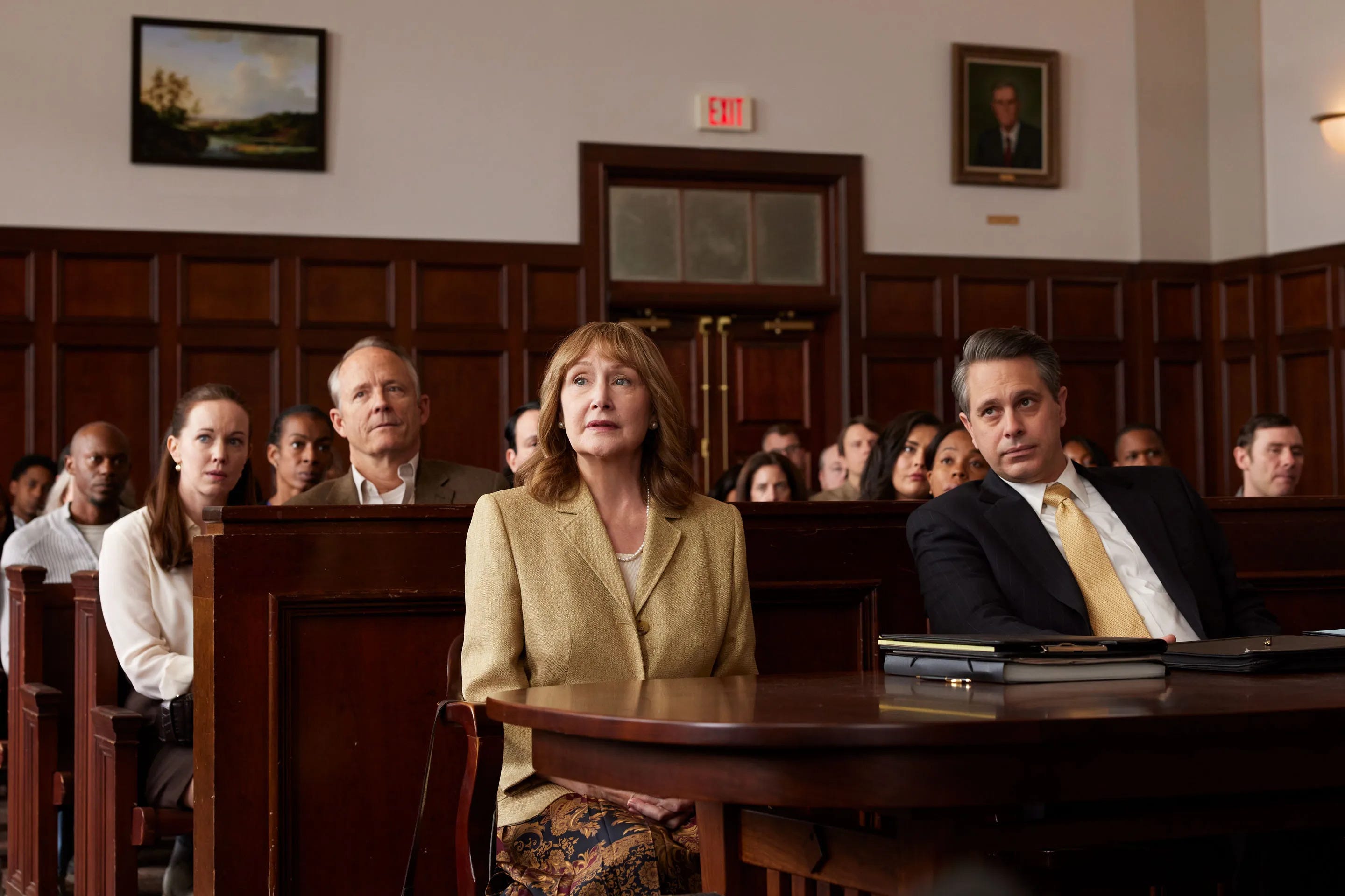 Patricia Clarkson sitting a courtroom for the movie Lilly