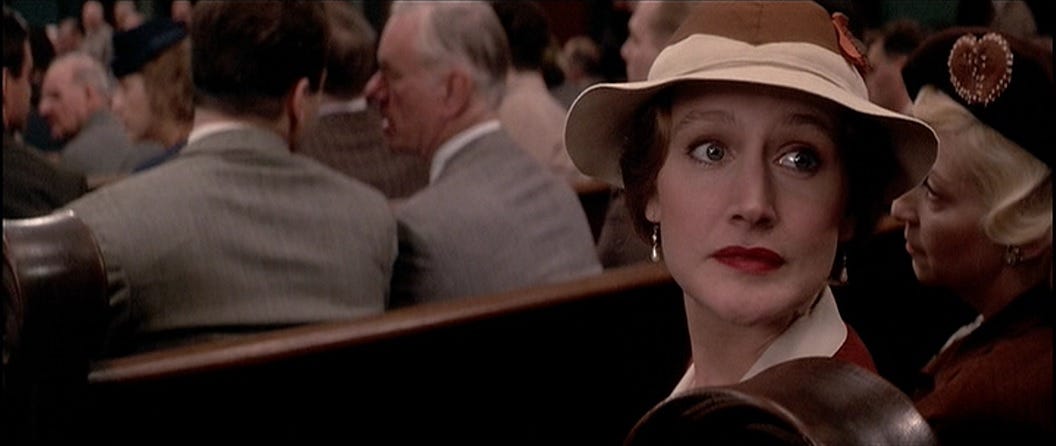 Patricia Clarkson sitting in a courtroom in The Untouchables