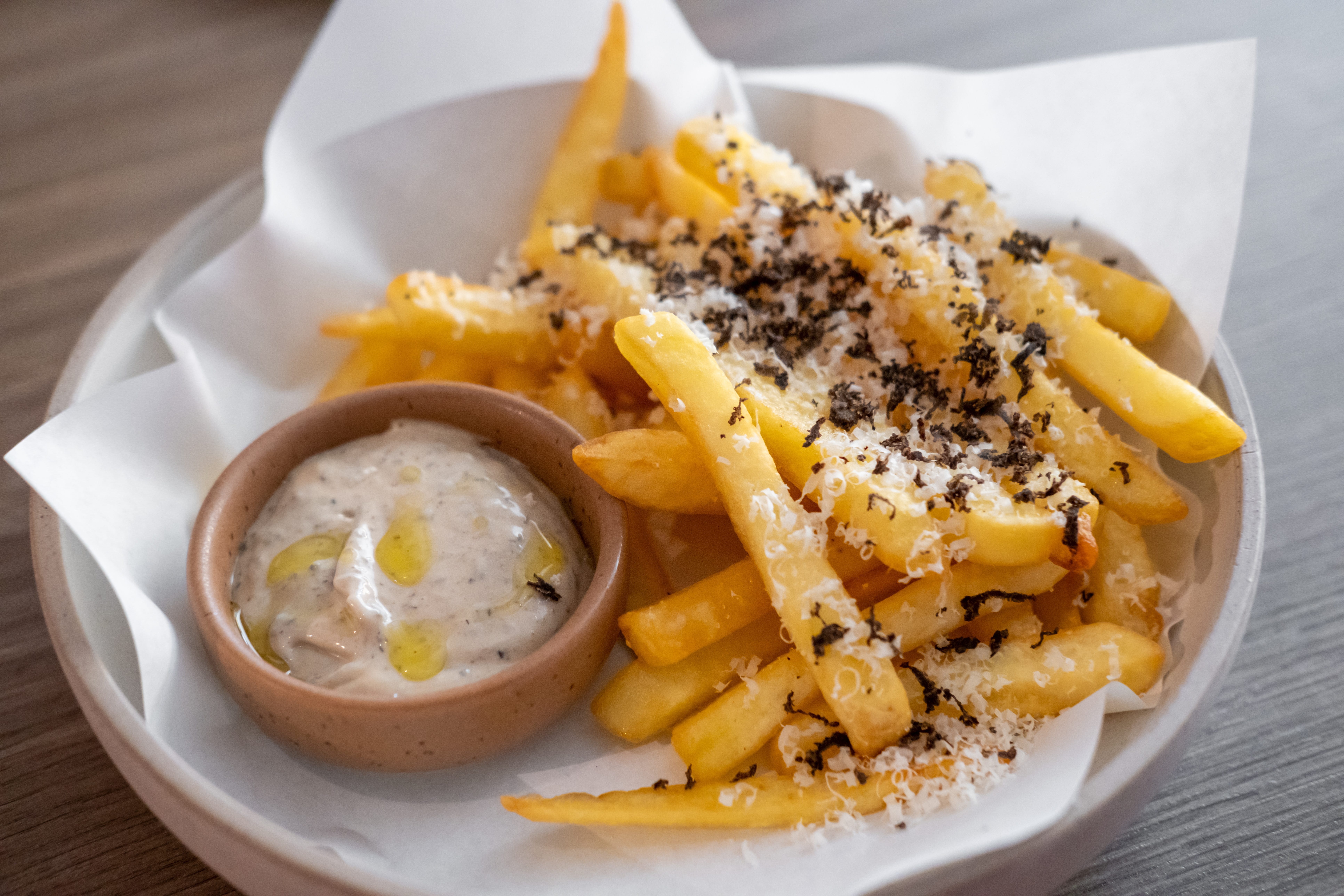 Fries with grated parm and truffle served with small cup of aoli