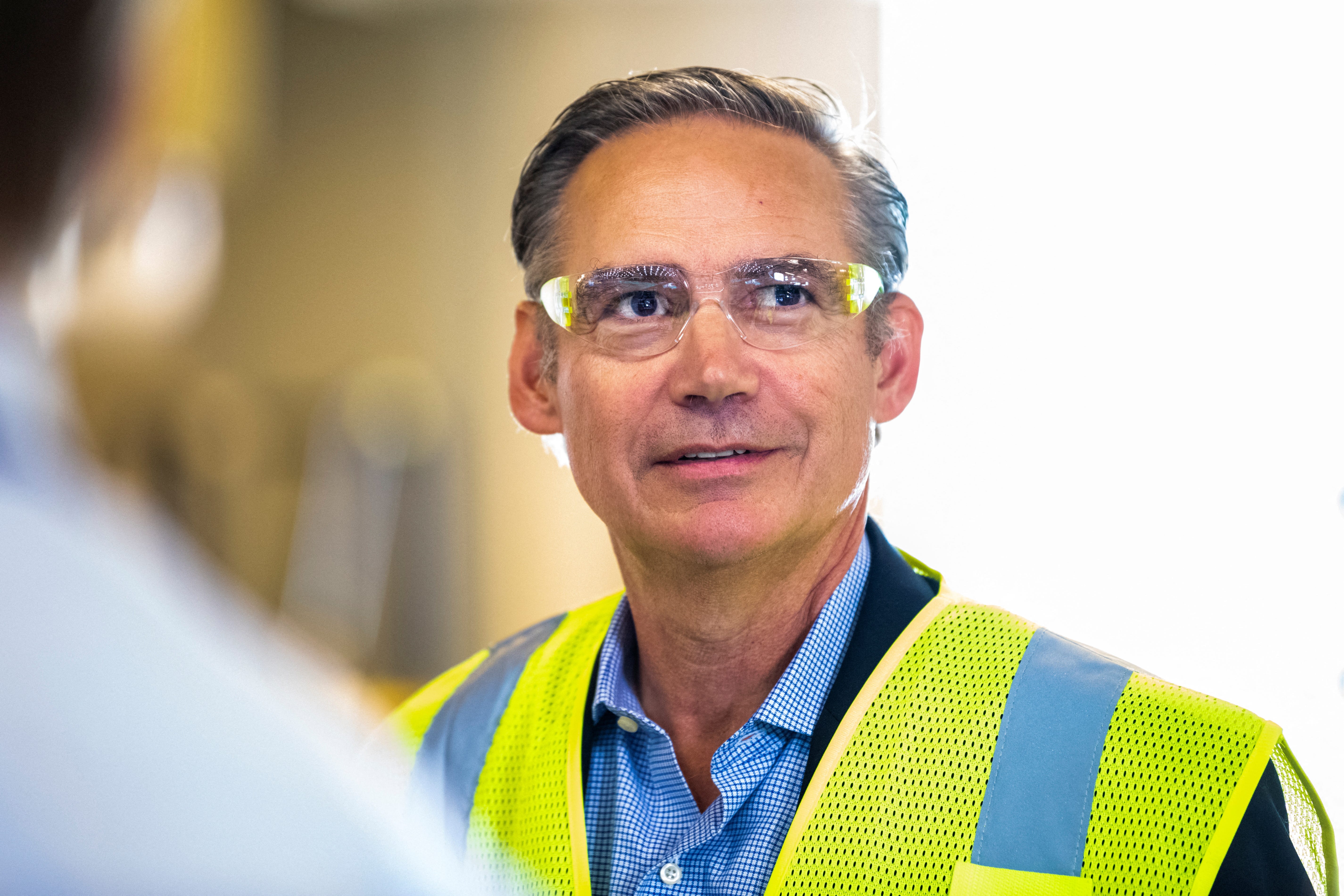 Kelly Ortberg wearing a high-vis vest and protective goggles.