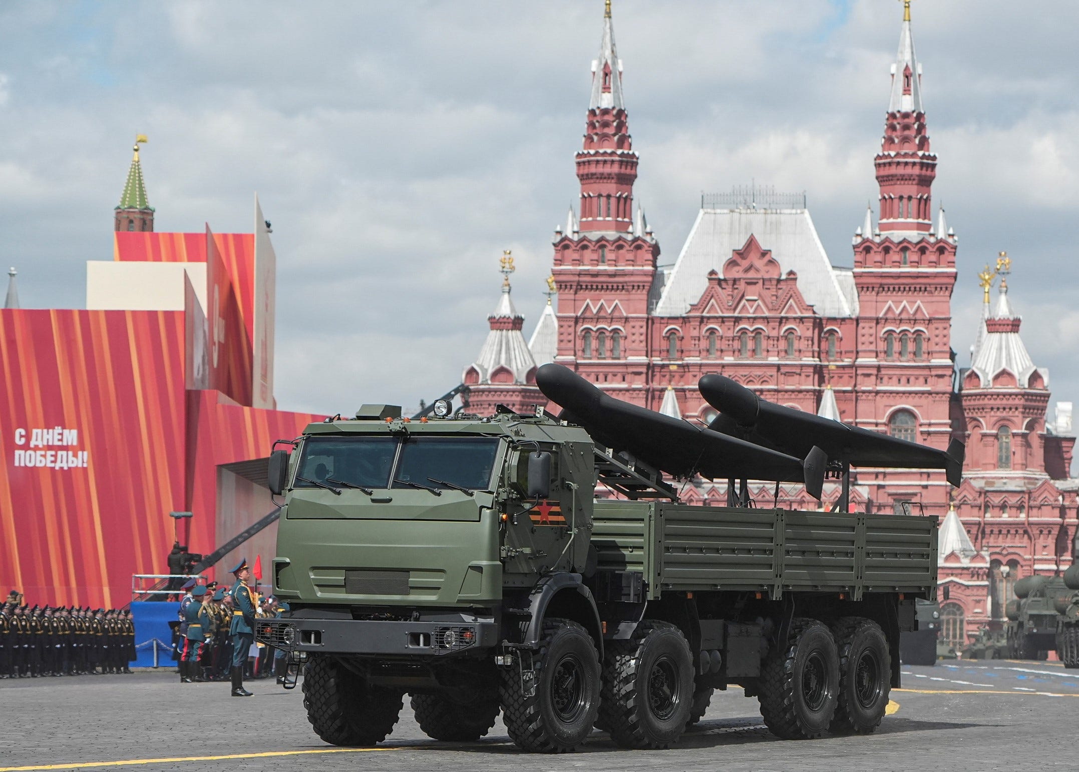 A Russian armored vehicle carries two attack drones during Moscow's Victory Day parade.
