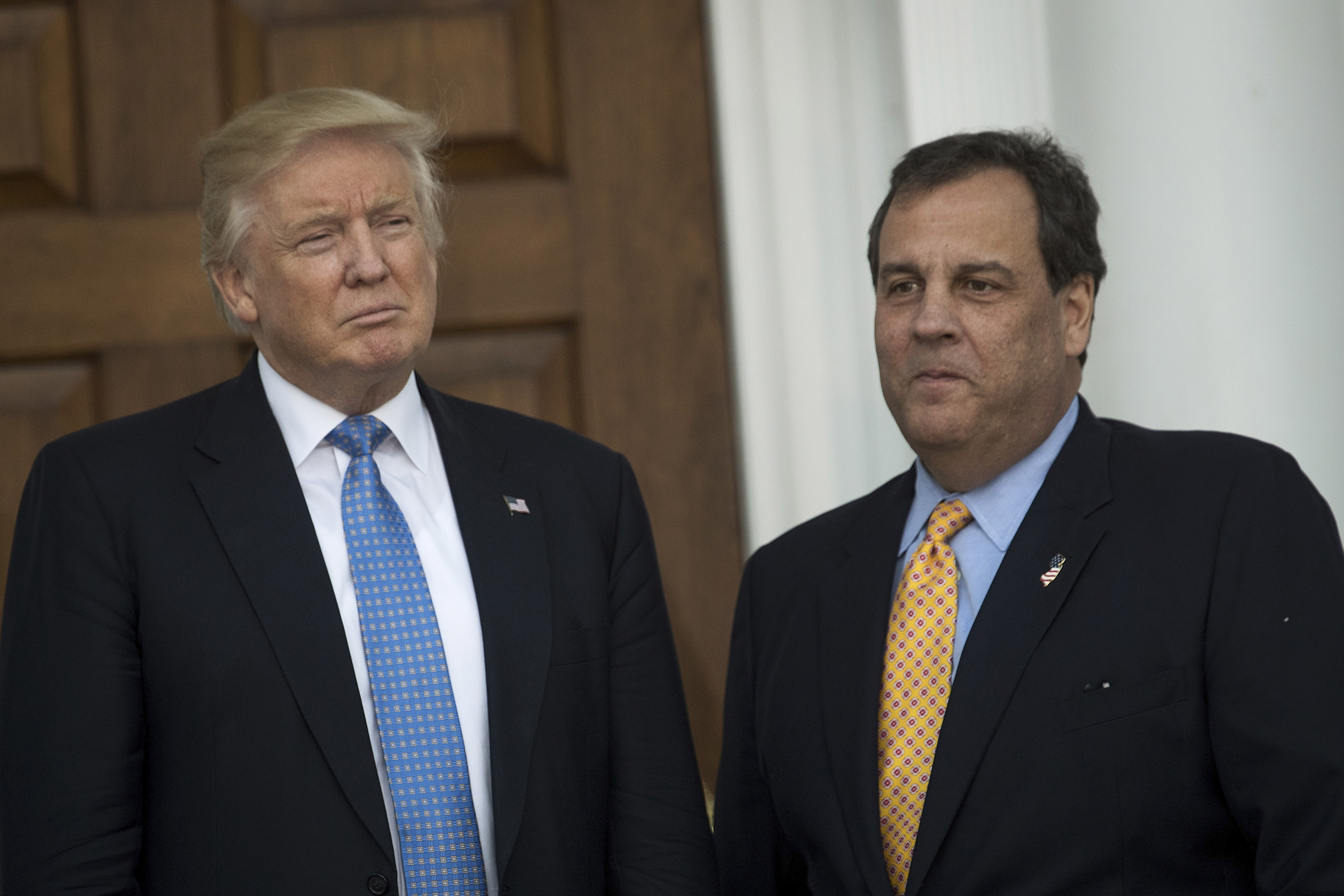 Donald Trump and Chris Christie stand side by side at an event. 