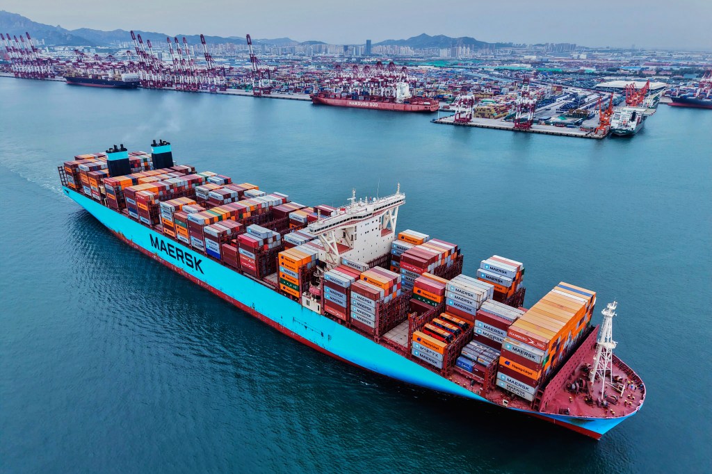 A container ship sails off a port in Qingdao in east China's Shandong province on Wednesday, May 7, 2025.