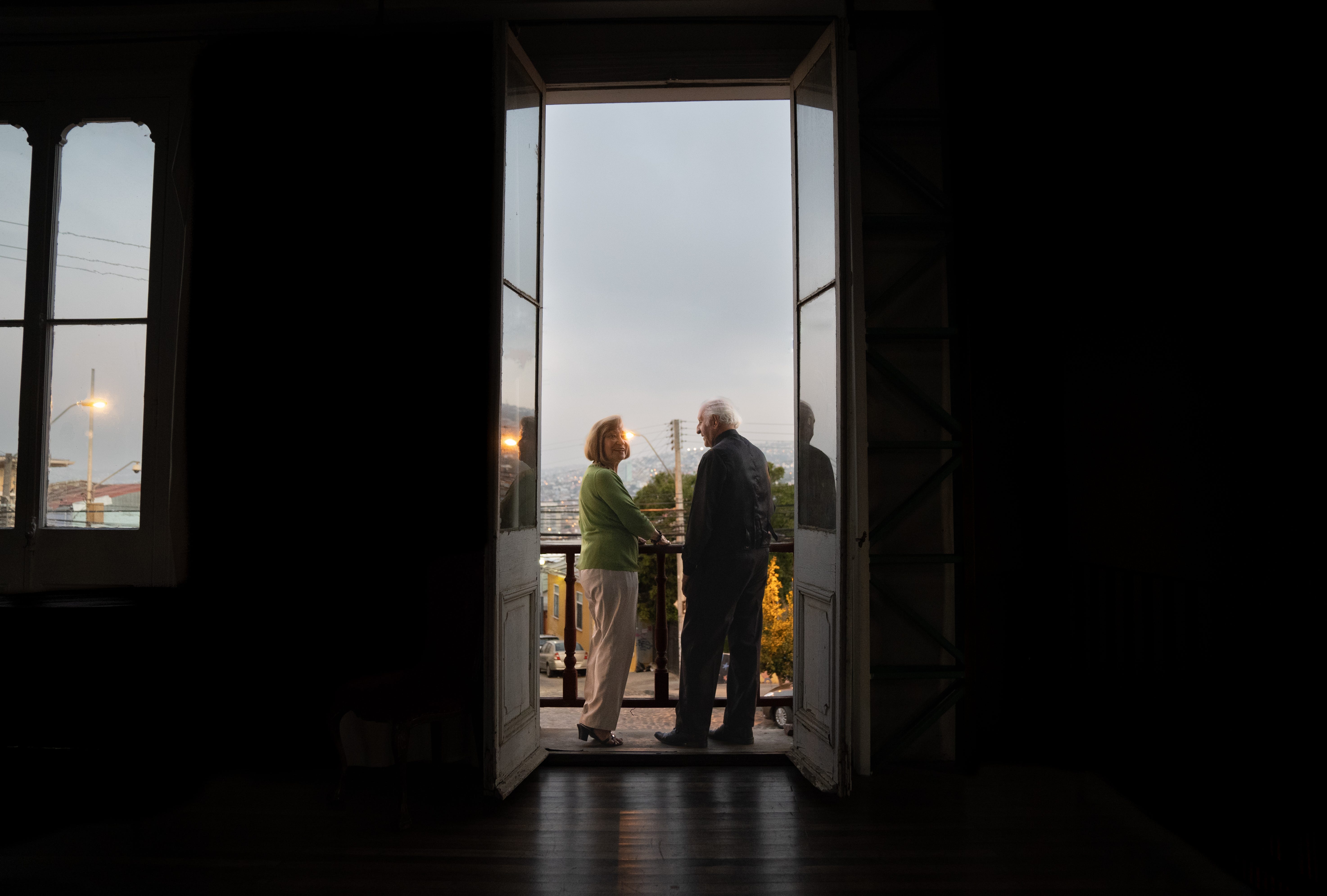 Old couple in doorway of hotel
