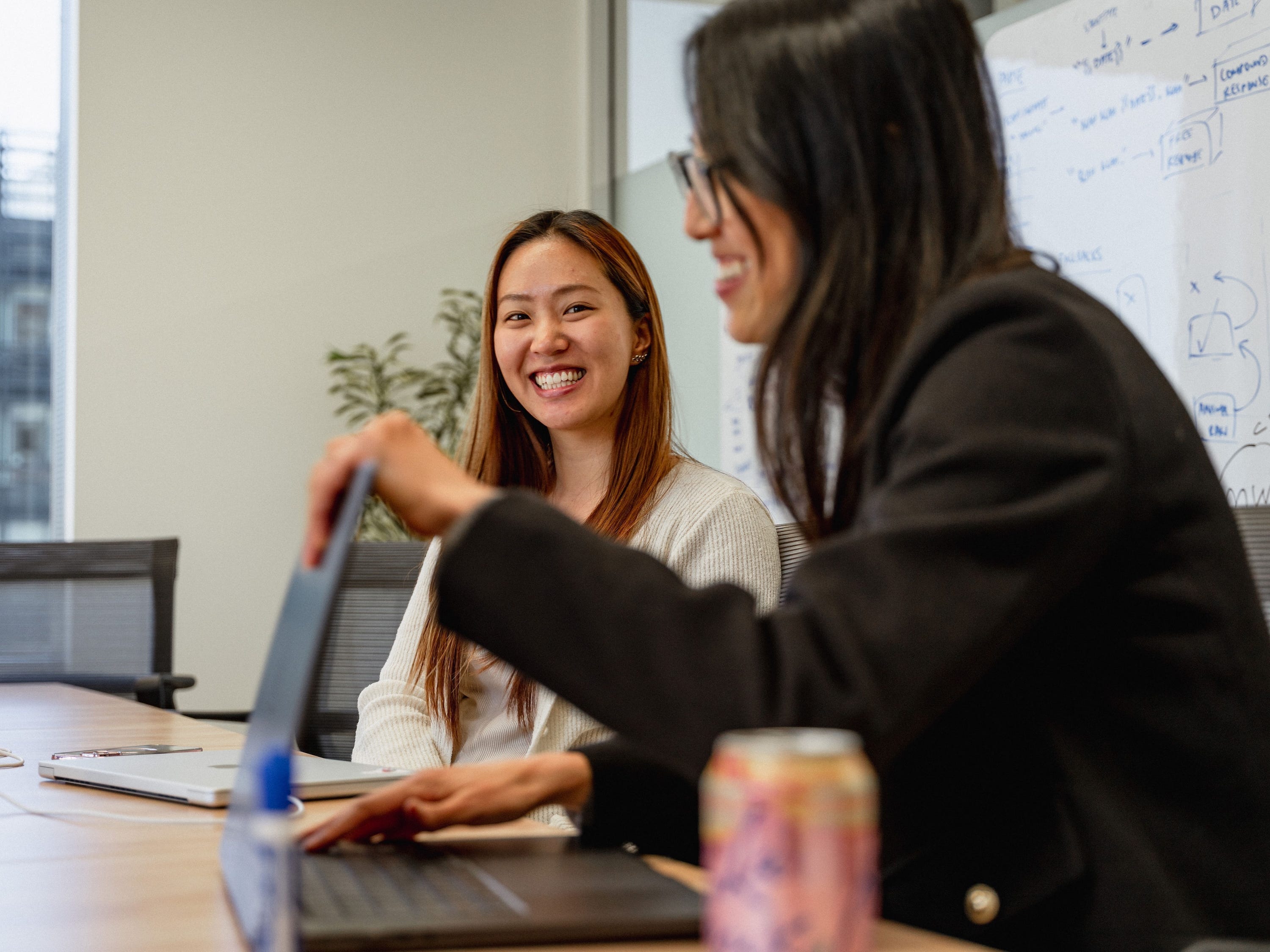 Harvey employees work during a product meeting.