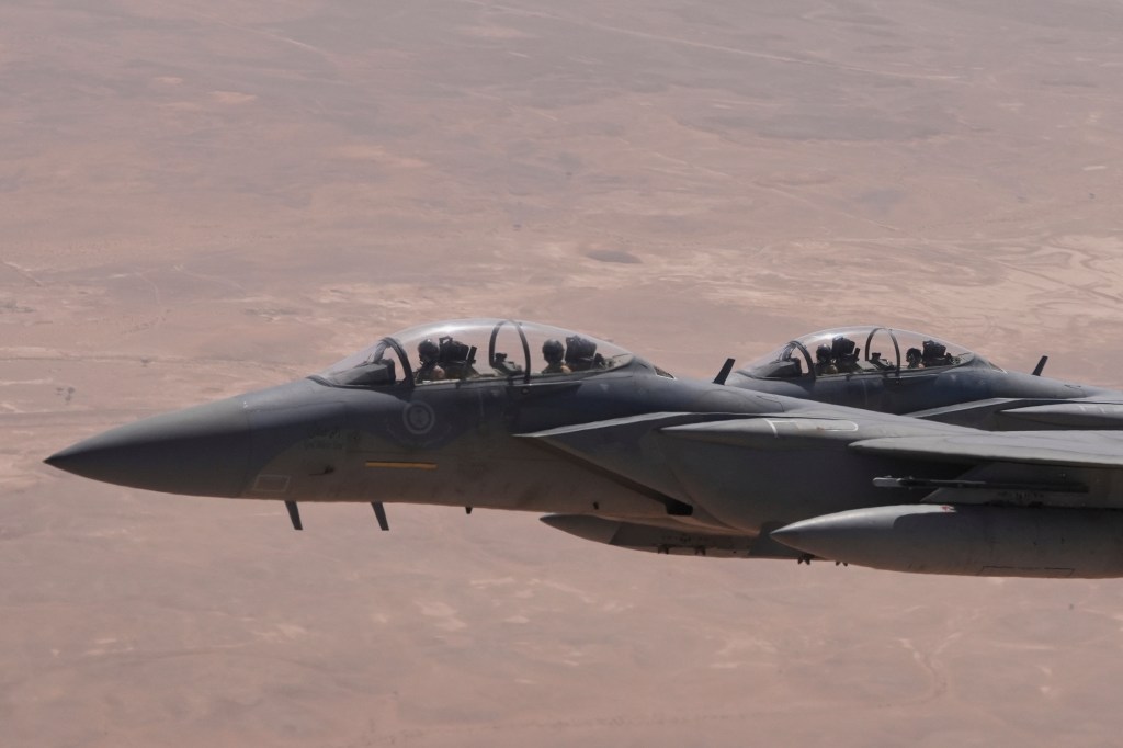 Saudi Air Force F-15 warplanes escort Air Force One carrying President Donald Trump as it arrives in Saudi Arabia, Tuesday, May 13, 2025.
