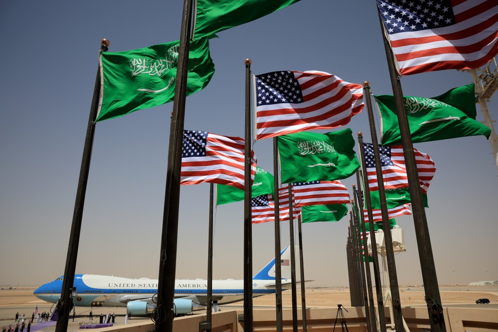 Saudi and U.S. national flags flutter as Air Force One ferrying U.S. President Donald Trump arrives at King Khalid International Airport on May 13, 2025, in Riyadh, Saudi Arabia.