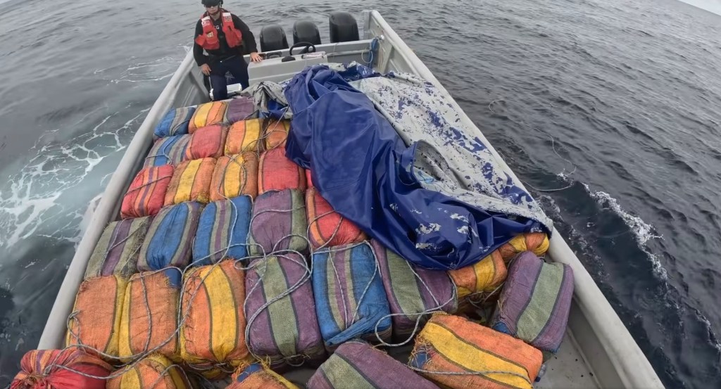 Coast Guard conducting a dramatic arrest of suspected drug smugglers in open ocean, featuring Andreas Hestler.