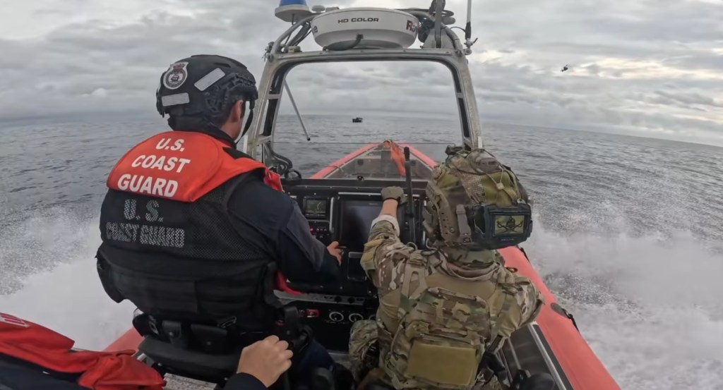 Coast Guard making a dramatic arrest of suspected drug smugglers in the open ocean