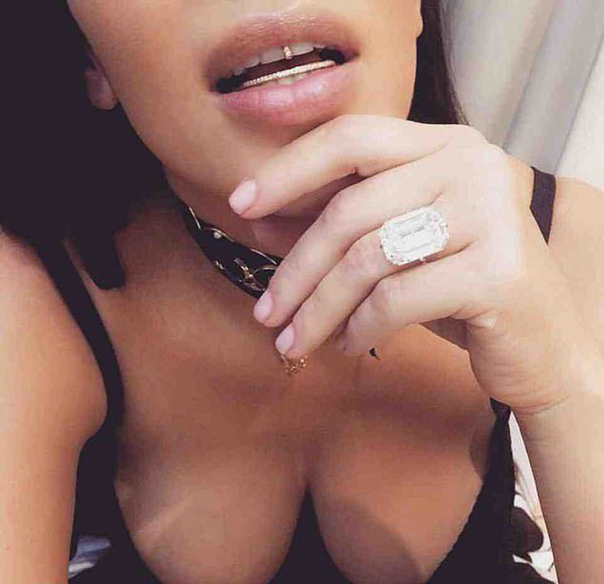 Kim Kardashian showing off her diamond ring