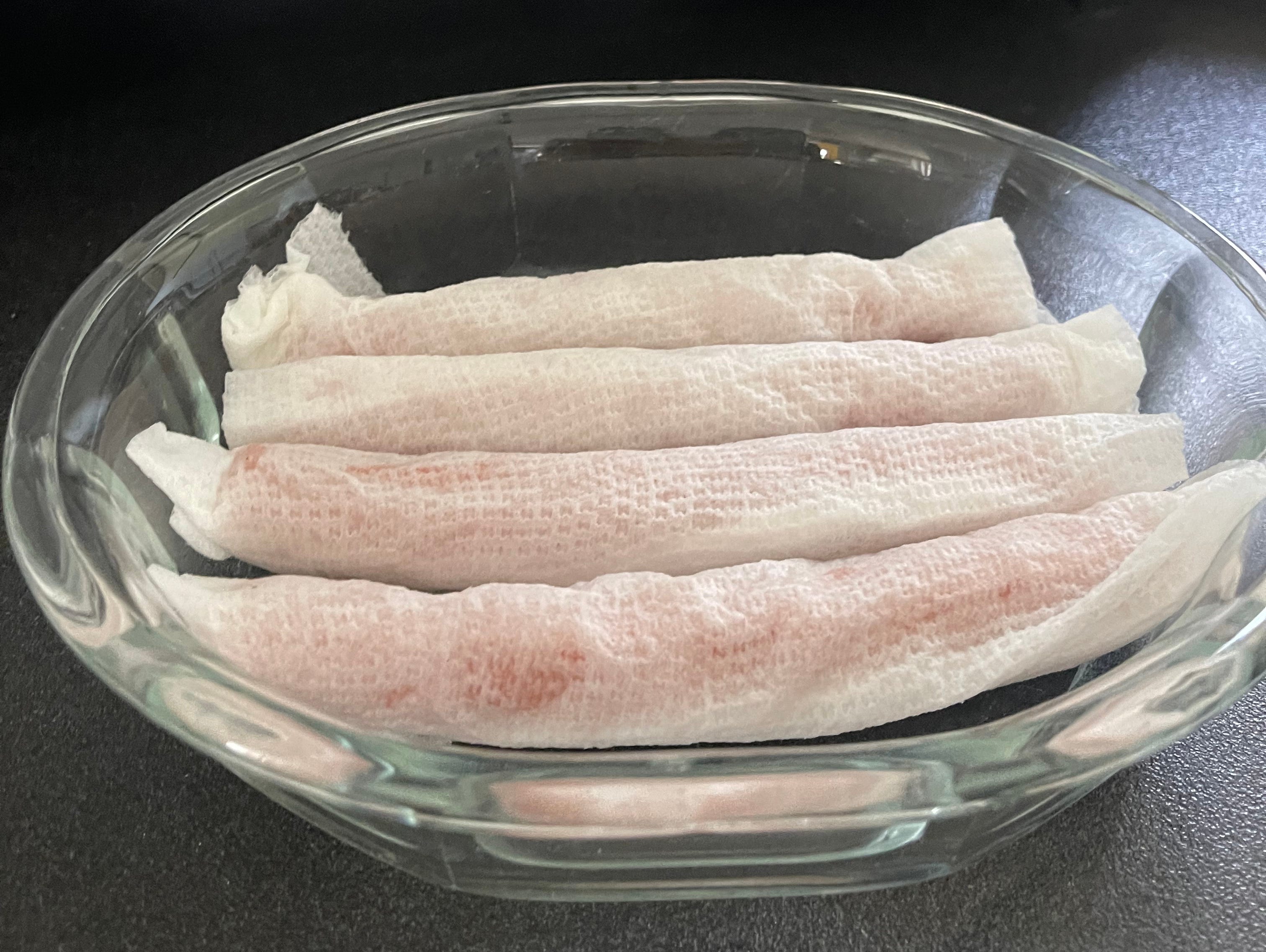 I chose to individually wrap each hot dog in a paper towel before microwaving.