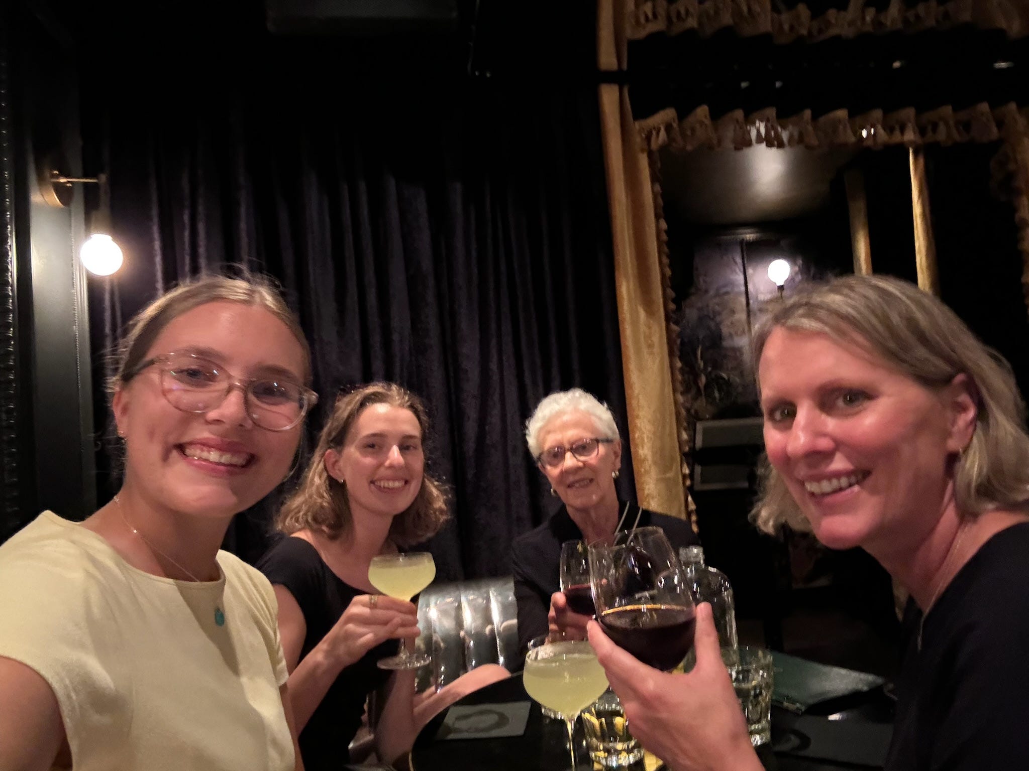 The author and her family posing with their drinks at a speakeasy in Montreal.