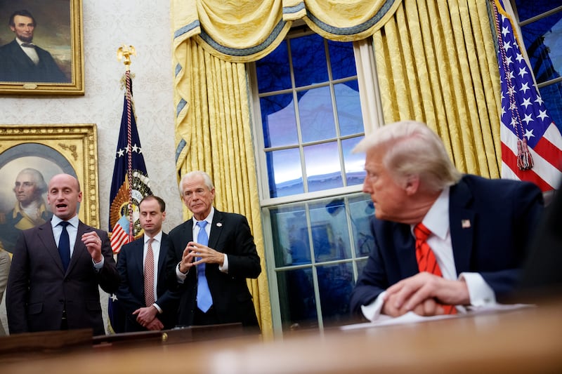 Stephen Miller and Donald Trump.